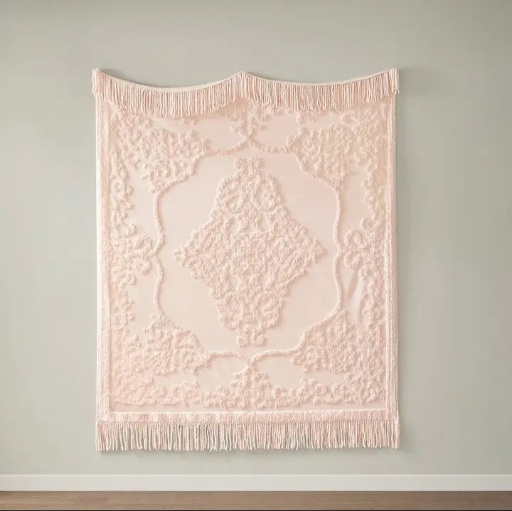 Couverture à franges rose, motif bohème